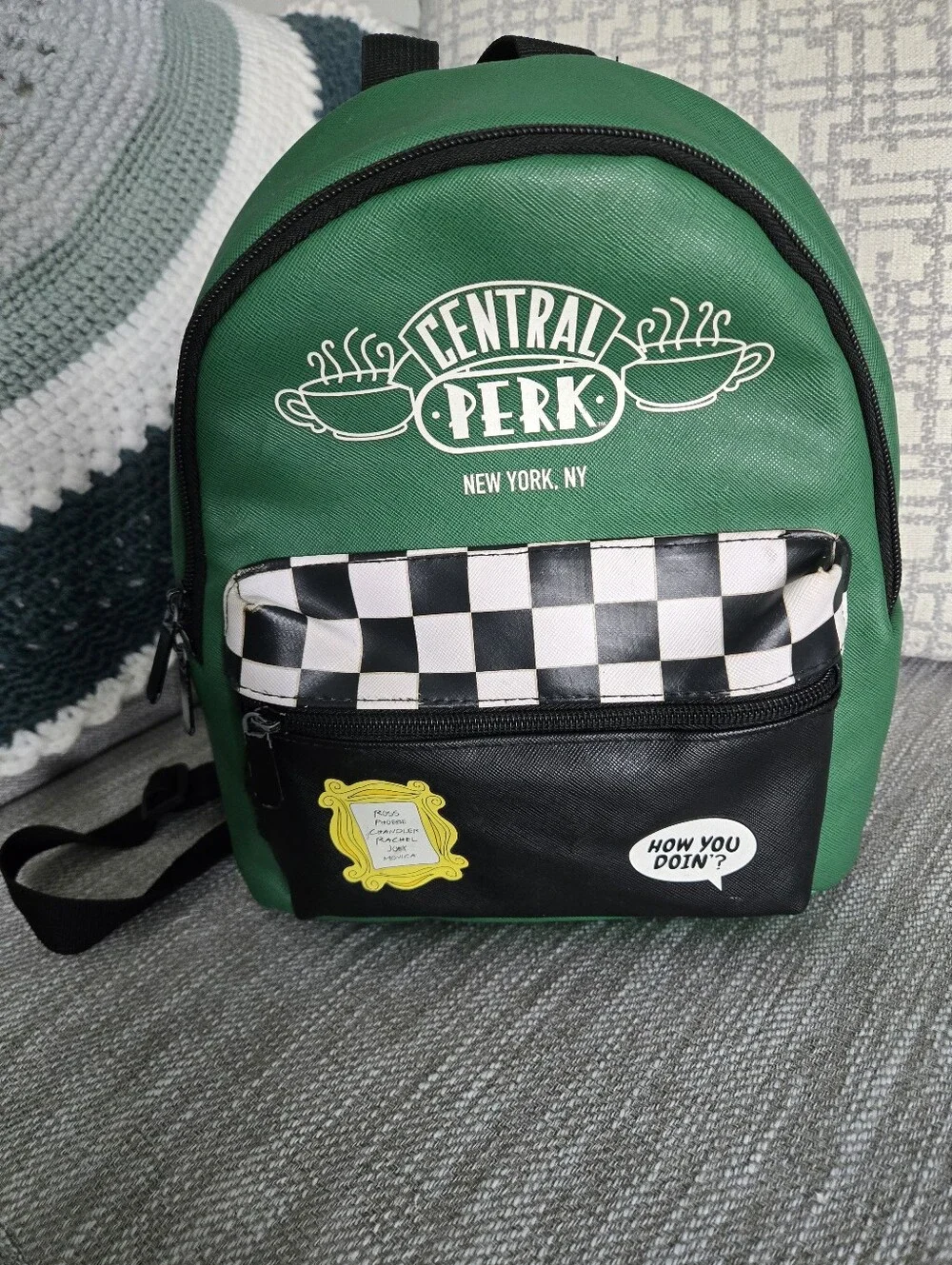 This green and black Friends Central Perk faux leather mini backpack